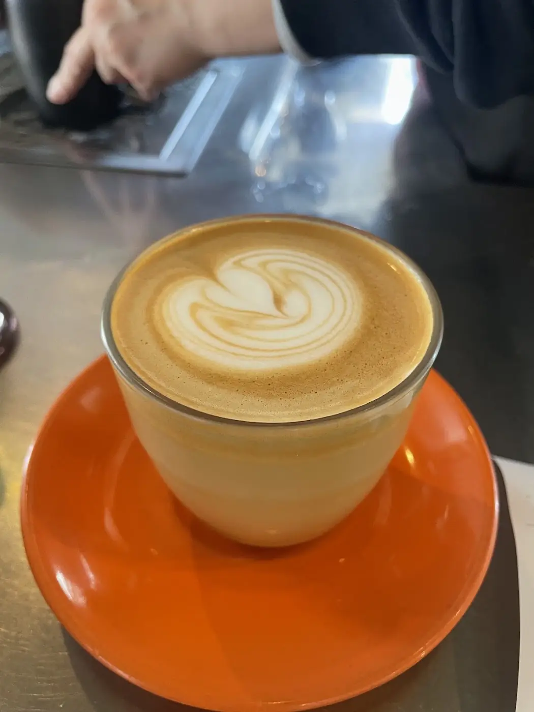 A latte with latte art at Thread Cafe